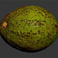 Fresh Ripe Avocado With Green Brown Speckled Skin On Dark Surface