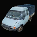 Old White Van With Blue Tarp Covered Cargo Bed And Worn Tires