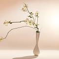 White Ceramic Vase With White Flowers And Green Leaves On Soft Light Minimalist Surface