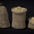 Three Different Sizes Burlap Sacks Filled With Corn Kernels For Household Storage