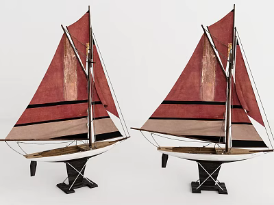 Two Decorative Sailboat Models With Red And Beige Sails Featuring Black Stripes On Black Bases 3d model