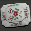 Dresser Vanity Decor with White Ceramic Box Adorned in Pink Green Floral Patterns and Lid