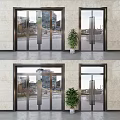 Modern Glass Entrance Doors With Metal Frames And Potted Plant Near Urban Buildings