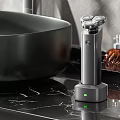 Sleek Electric Shaver On Charging Base With Green Indicator On Bathroom Marble Countertop