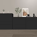 Gray Chest of Drawers on Light Wooden Floor with Green Plants Decorations and Wall Art