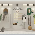 Fashion Window Display with Mannequins in White Yellow Dresses Cactus Green Plants and Wall Decor