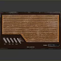 PC Accessory Device With Brown Casing Orange Grill Pattern Buttons And Interface Ports