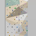 Colorful Indoor Climbing Wall With Multicolored Holds And Safety Rope