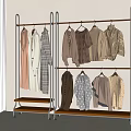 Stylish Clothes in Neutral Tones Hanging on Metal Racks with Wooden Bases