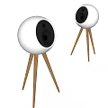 Two White Ball Shaped Speakers with Black Speaker Units on Wooden Tripods