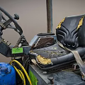 Utility Vehicle With Worn Driver Seat Steering Wheel Blue Gas Cylinder Yellow Hoses And Labels