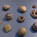 Assorted Bread Desserts Including Donuts Cookies With Sesame Seeds Chocolate Coating On Gray Background