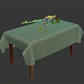 Rifle with orange components on wooden table with beige tablecloth and bullet casings nearby