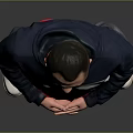 Man Standing in Navy Blue White and Red Hoodie With Gray Pants and White Shoes