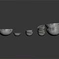 Silver Kitchen Bowls and Plates Stacked in Various Sizes for Daily Use