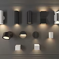 Modern Wall Lamps With Various Black And White Designs Mounted On Gray Wall