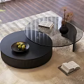 Modern Black Round Glass Coffee Table With Books Vase And Fruit Bowl On Rug