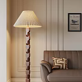 Cozy Living Room Interior With Pleated Lampshade Floor Lamp Brown Sofa And Blue Bird Painting