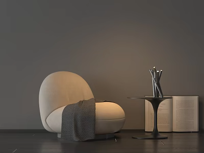 Beige Bean Bag Chair With Gray Blanket Side Table Metal Vase Open Book 3d model