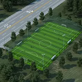 Aerial Planning of Soccer Field With Surrounding Trees Road Fencing and Lights