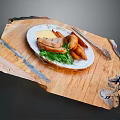 Delicious Grilled Meat Dish With Crispy Fries And Fresh Green Salad On Wooden Cutting Board