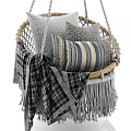Cozy Woven Hanging Chair With Wooden Armrests Pillows And Plaid Blanket