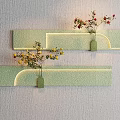 Green Glittery Curved Wall Decor With Small Vases Holding Yellow and Red Flowers