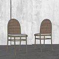 Modern Dining Chairs With Woven Backrest And Light Colored Seat Cushion In Minimalist Interior