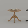 Wooden Side Table with Round Top and Three Legs Featuring Open Book on Surface 3d model