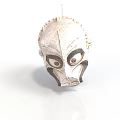 Traditional Cultural Mask With White Surface Black Accents And Large Eyes