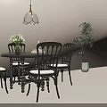 Vintage Style Black Round Dining Table With Four Comfortable Padded Chairs For Cozy Home Dining Room