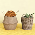 Woven Storage Baskets with Dried Flowers and Green Leaf on Yellow Tabletop Against Beige Wall