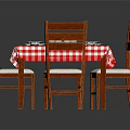 Wooden Dining Table With Four Chairs And Red White Checkered Tablecloth With White Plates