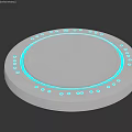Round Silver Device With Blue LED Lights And Circular Platform Design