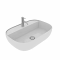 Modern White Ceramic Oval Bathroom Washbasin With Sleek Faucet And Smooth Surface Design