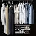 Organized Clothes Hanging On Hangers With Shirts Pants And Shoes Below