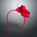Red Headband With Large Bow And Tulle Decorations On Gray Background