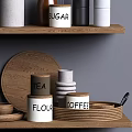 Stylish Kitchenware Arranged On Wooden Shelves With Pitcher Mugs Spoons Jars And Glasses