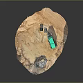Green Toy Truck On Dirt Terrain Model With Rocky Elements And Black Object