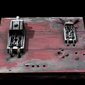 Vintage Switch Panel on Red Worn Wooden Board with Rusted Mechanisms and Holes