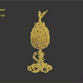 Golden egg shaped decorative ornament set with bird on top and intricate base design