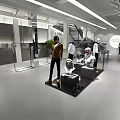 Modern Clothing Store Interior With Mannequins Displaying Stylish Outfits On Concrete Platforms And Bright Lighting