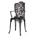 Ornate Metal Chair With Intricate Carved Patterns And Decorative Armrests