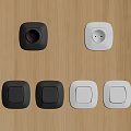 Modern Black And White Switch Panels On Wooden Surface With Light Switches And Sockets