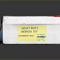 White DELUX First Aid Kit With Blue Cross Symbol Red Stains And Blue Latch