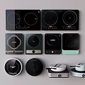 Various Modern Kitchen Appliances Including Induction Cooktops And Electric Hot Plates