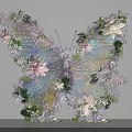 Butterfly Shaped Art Installation With Pink White Purple Flowers Green Leaves and Transparent Wings