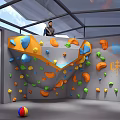 Indoor Climbing Gym With Colorful Holds On Walls And People Climbing Inside