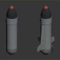 Three Metallic Military Bombs with Red Tips and Fins on Reflective Surface