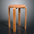 Modern Wooden Stool With Round Seat And Four Smooth Light Brown Legs For Minimalist Interior